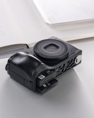 Ricoh GR IV metal handle with base enhances grip feeling and features an ultra-thin base plate design