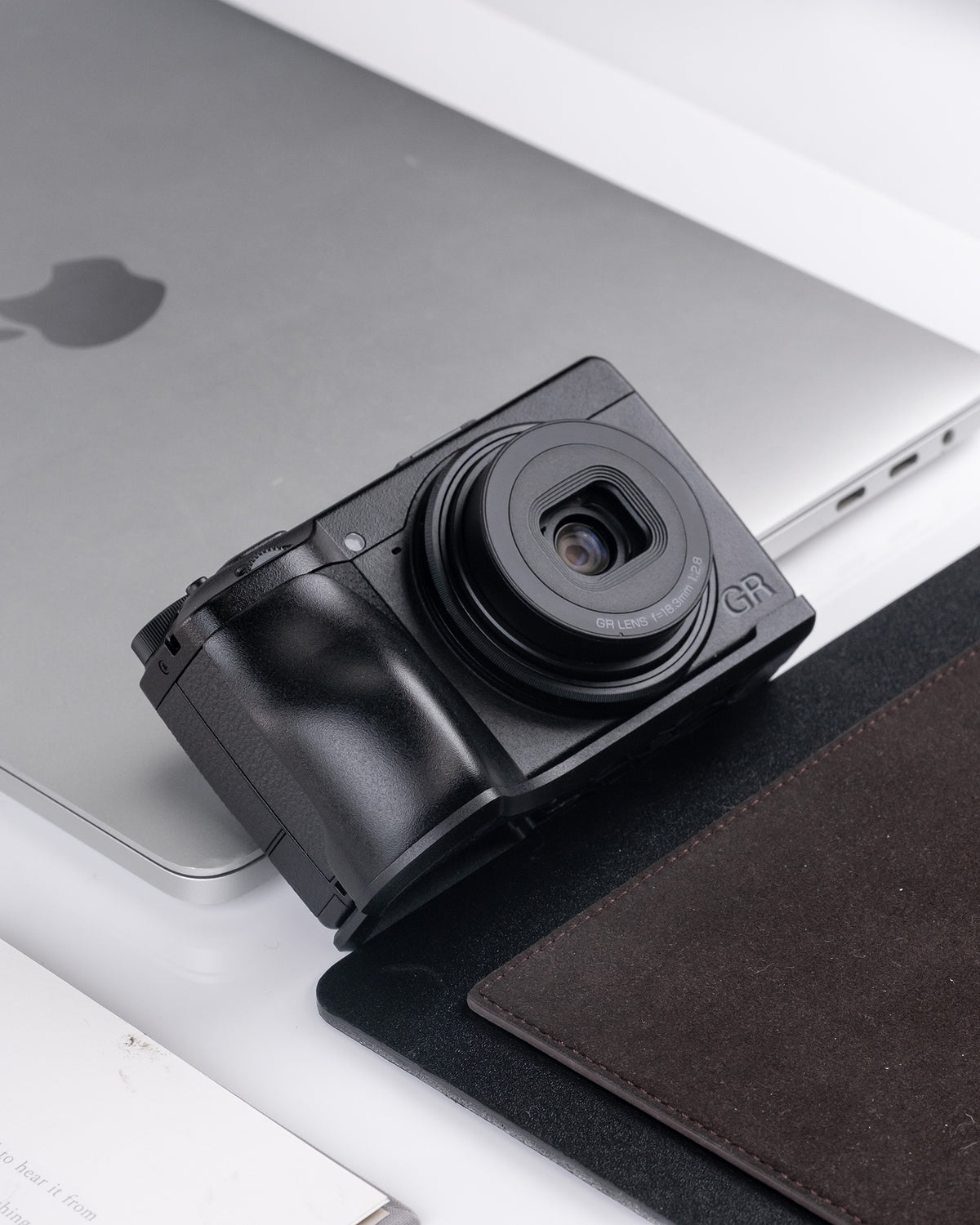 Ricoh GR IV metal handle with base enhances grip feeling and features an ultra-thin base plate design